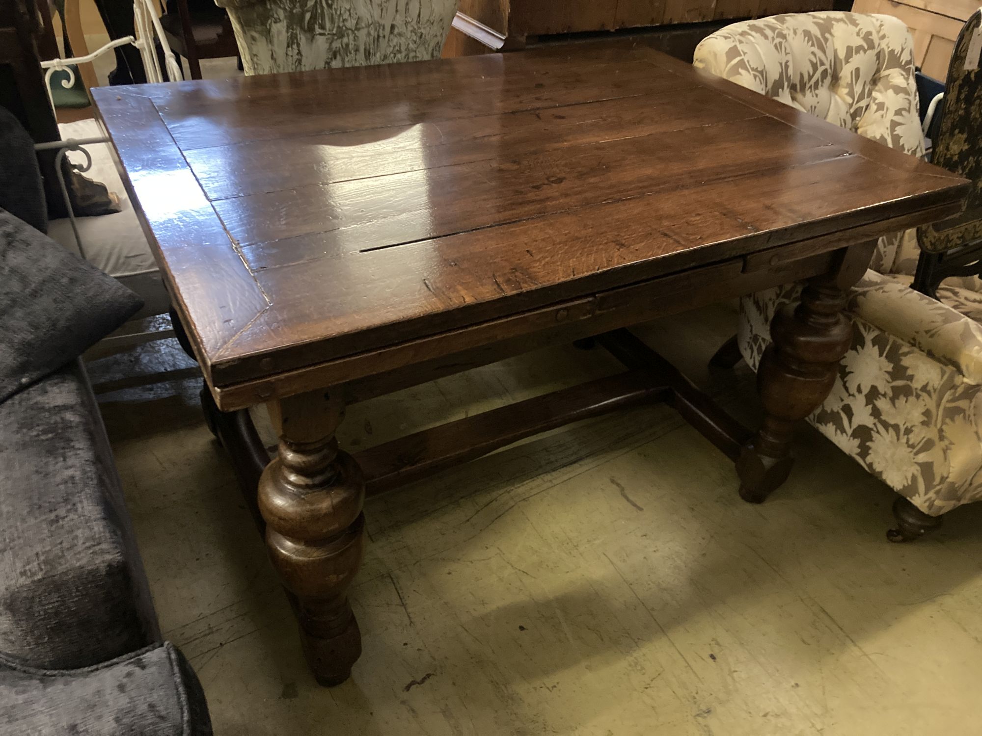 An 18th century Dutch style draw leaf dining table, length 216cm extended, width 90cm, height 78cm